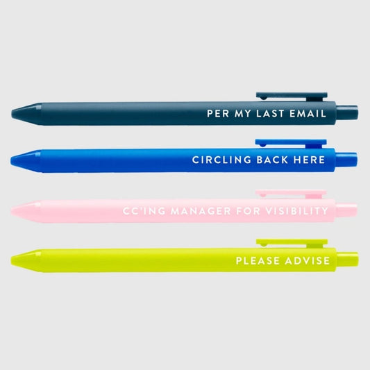 Funny 4 pack of corporation passive aggressive saying pens in 4 colors sitting on gray background. Little Gift Nook