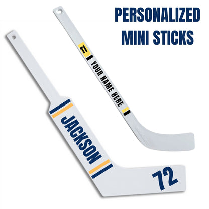 Personalized mini hockey sticks with customizable text on goalie or player sticks sitting on a white background.
