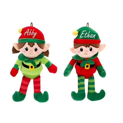 Two Christmas elves plush ornament dolls with custom names on hats sitting on white background. Little Gift Nook