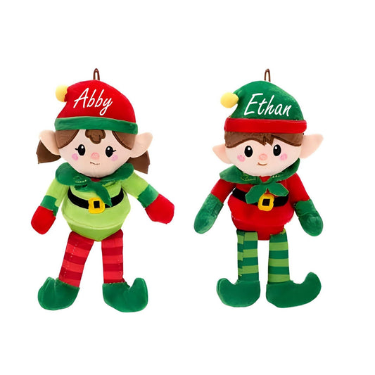 Two Christmas elves plush ornament dolls with custom names on hats sitting on white background. Little Gift Nook
