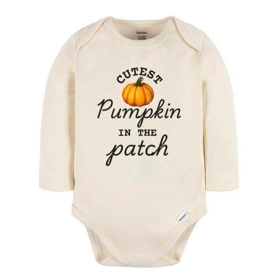 Creme long sleeved baby bodysuit with "Cutest Pumpkin in the patch" on front with orange pumpkin image sitting on white background. Little Gift Nook