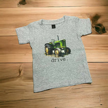 Load image into Gallery viewer, Gray toddler Child t-shirt with green vintage tractor and the word drive on front. 