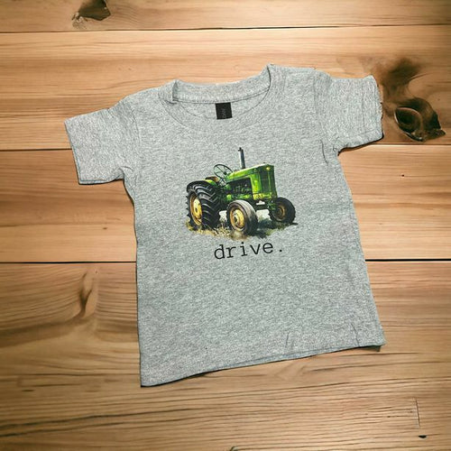 Gray toddler Child t-shirt with green vintage tractor and the word drive on front. 