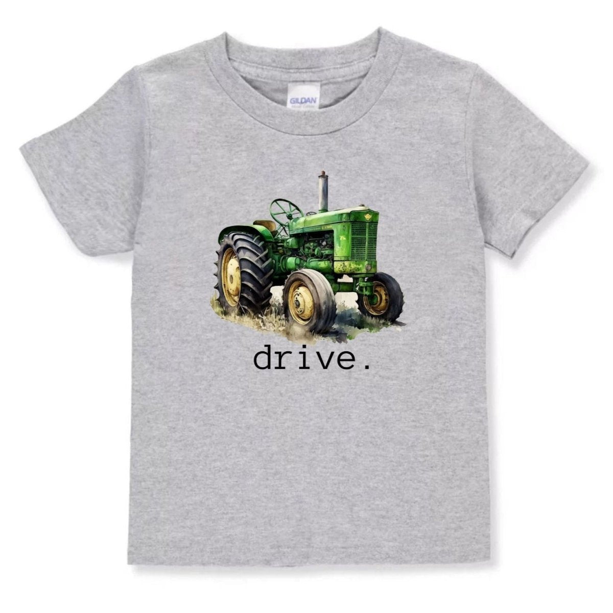 Gray toddler tshirt with green tractor and text "DRIVE" underneath it sitting on white background. 