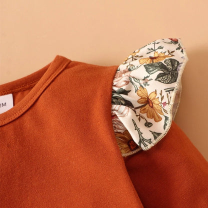 Close up of baby Floral Baby Girl dress set top with ruffle floral lettuce edge shoulder sleeve. Little Gift Nook.