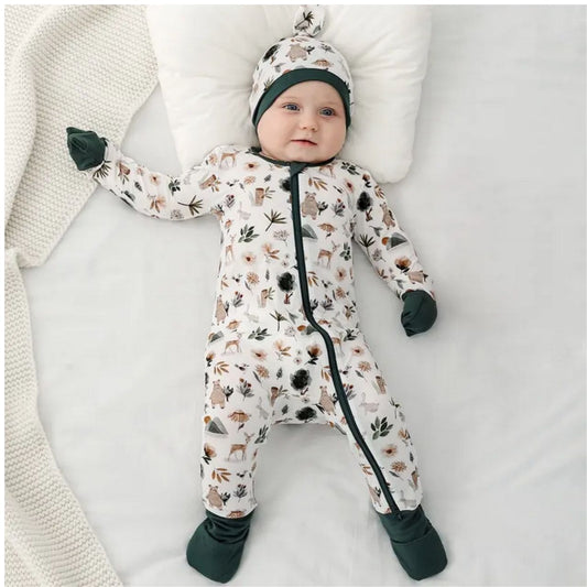 Forest Friends Bamboo Sleeper with fold over feet & hands. Cream & forest green fold over hands & feet. Sleeper shown on model with matching hat. Double zipper. Soft & Stretchy. Little Gift Nook.