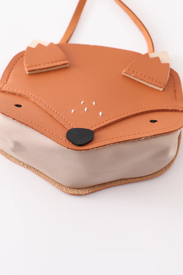 orange fox face kids purse laying flat on white background.
