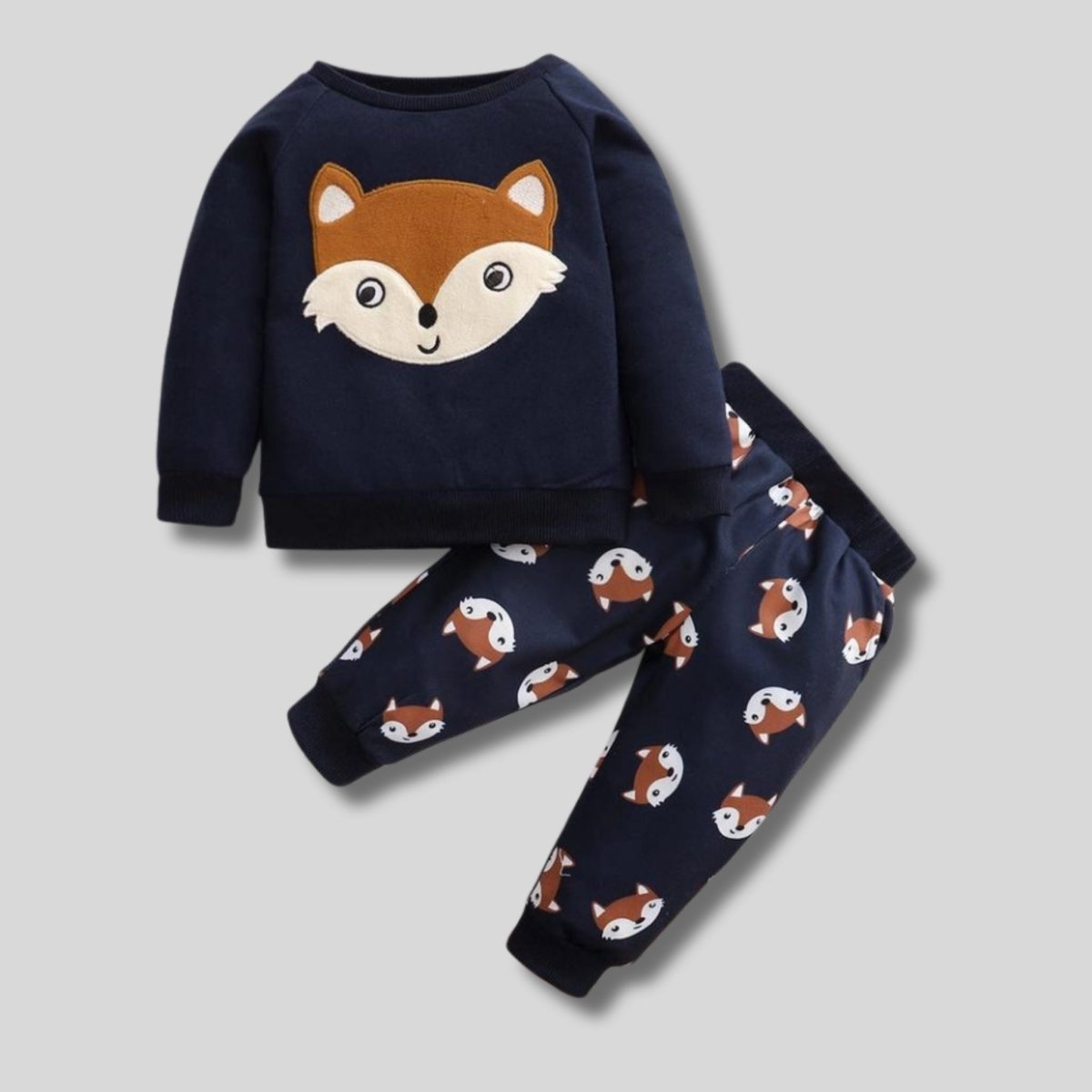 Baby boy navy Fox print pullover top and cuffed sweatpants. Navy with brown fox print. Shown on gray background. - Little Gift Nook