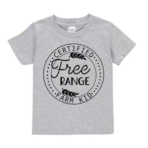 Heather gray toddler t-shirt with black circular design and "Certified Free Range Farm Kid" on front laying on white background.