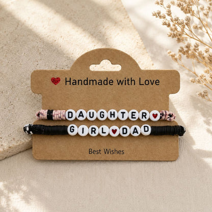 2 beaded bracelets Girl Dad and Daughter matching on a kraft hanging card and beige background.