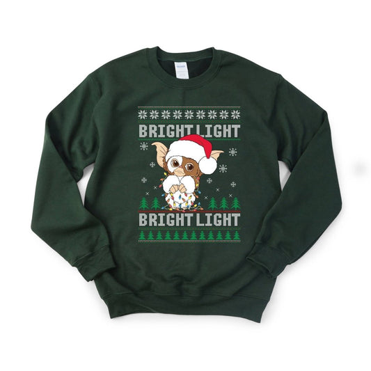 Forest green Gizmo Gremlins Holiday Christmas Bright Light Sweatshirt sitting on white background. Little Gift Nook