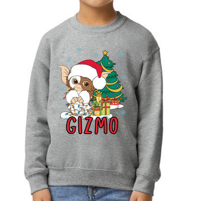 Child wearing light gray Gizmo Holiday Christmas sweatshirt standing on white background. 