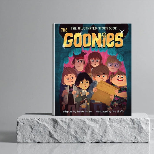 Illustrated storybook titled 'The Goonies' on a gray platform with a gray background.