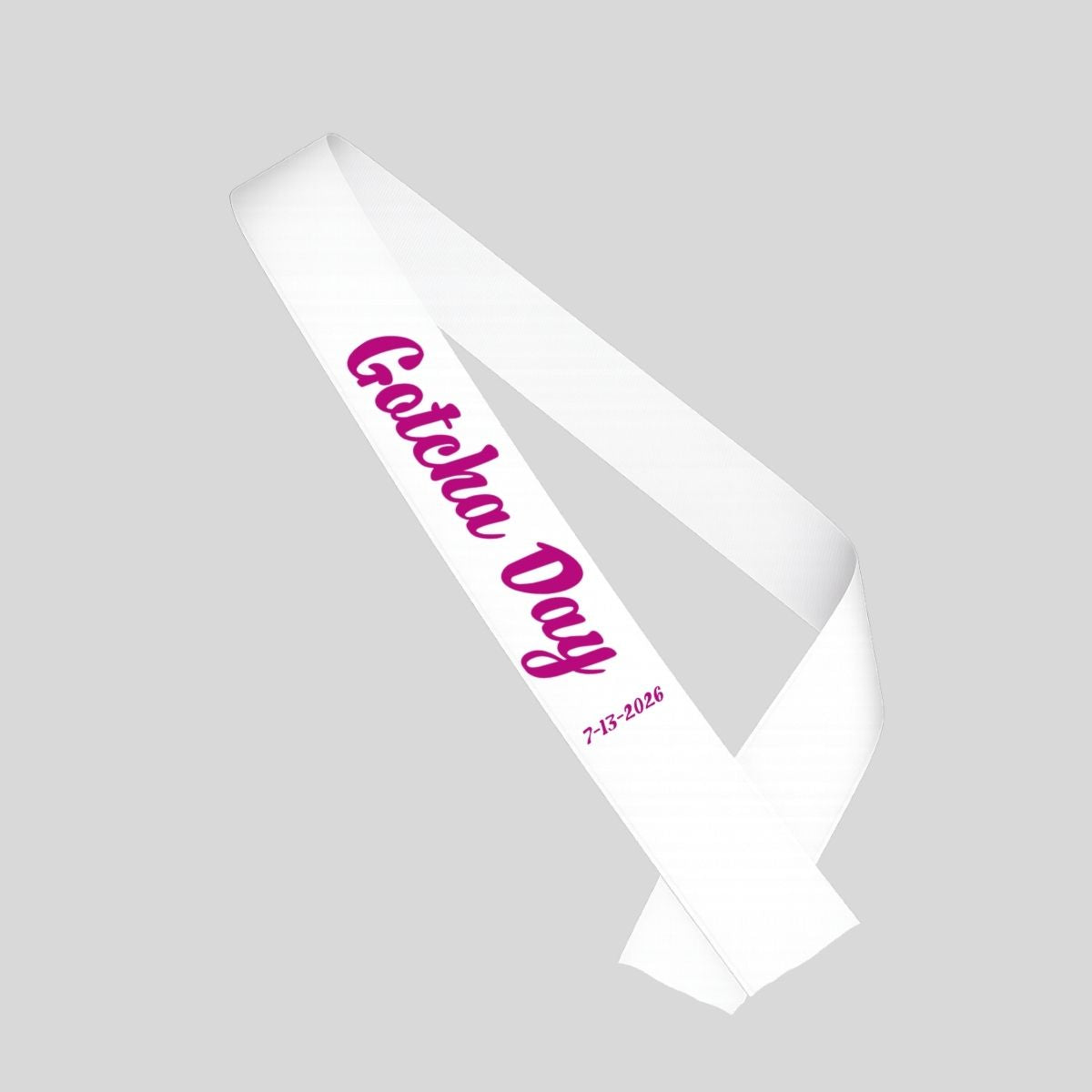 White sash with pink "Gotcha Day" and date sash for adoption on a gray background.