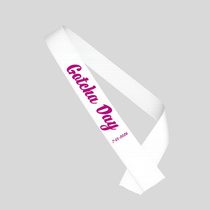 White sash with pink "Gotcha Day" and date sash for adoption on a gray background.