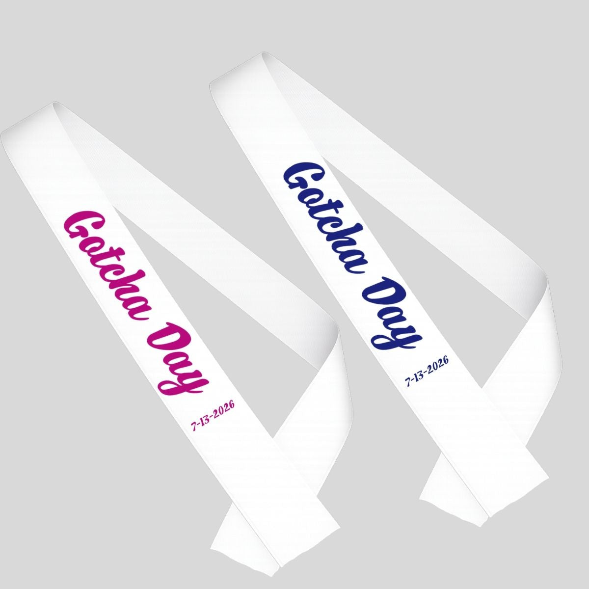 Two white sashes with 'Gotcha Day' text in blue or pink on a gray background.
