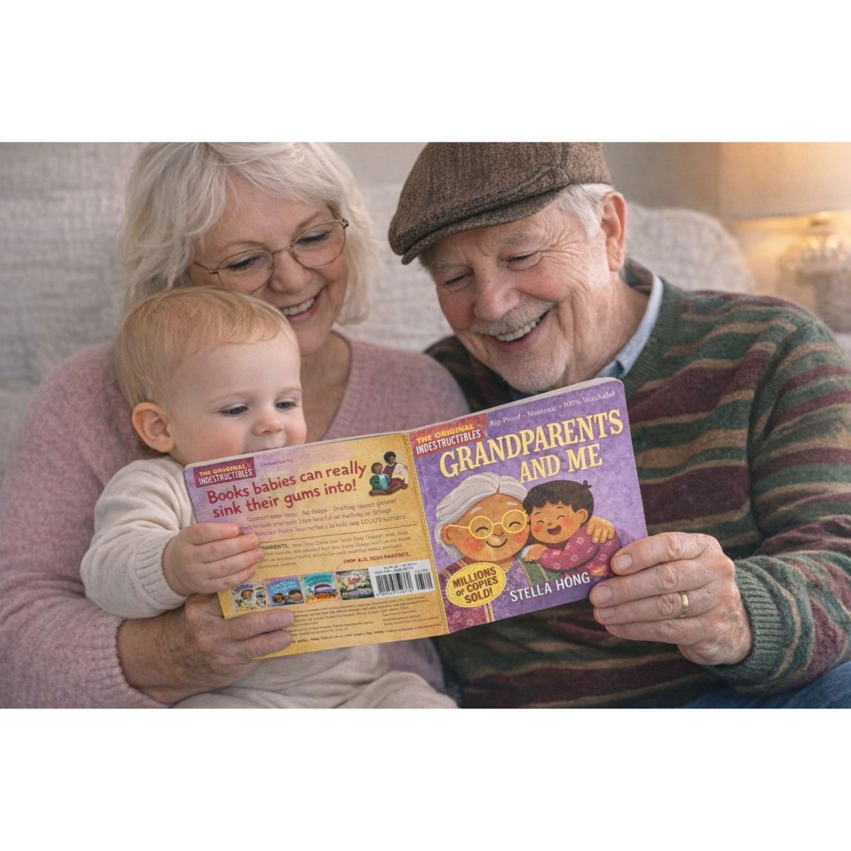 Grandparents and baby holding a indestructible book titled 'Grandparents and Me'.