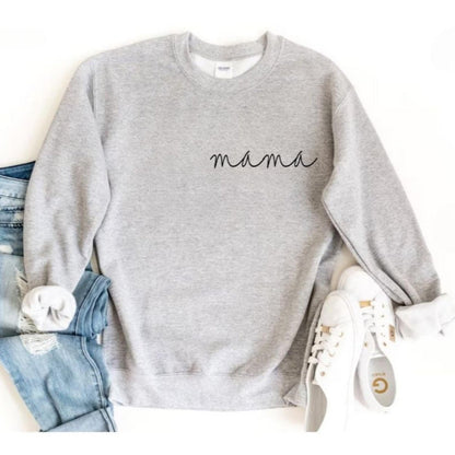 Heather gray crewneck sweatshirt with black mama on top left with jeans & running shoes on a white background.