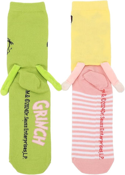 back view of Grinch and Cindy-Lou magnetic hand holding socks on white background. 