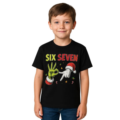 Boy wearing black tshirt with Six seven 6-7 Grinch Santa hands on front. Standing on white background.