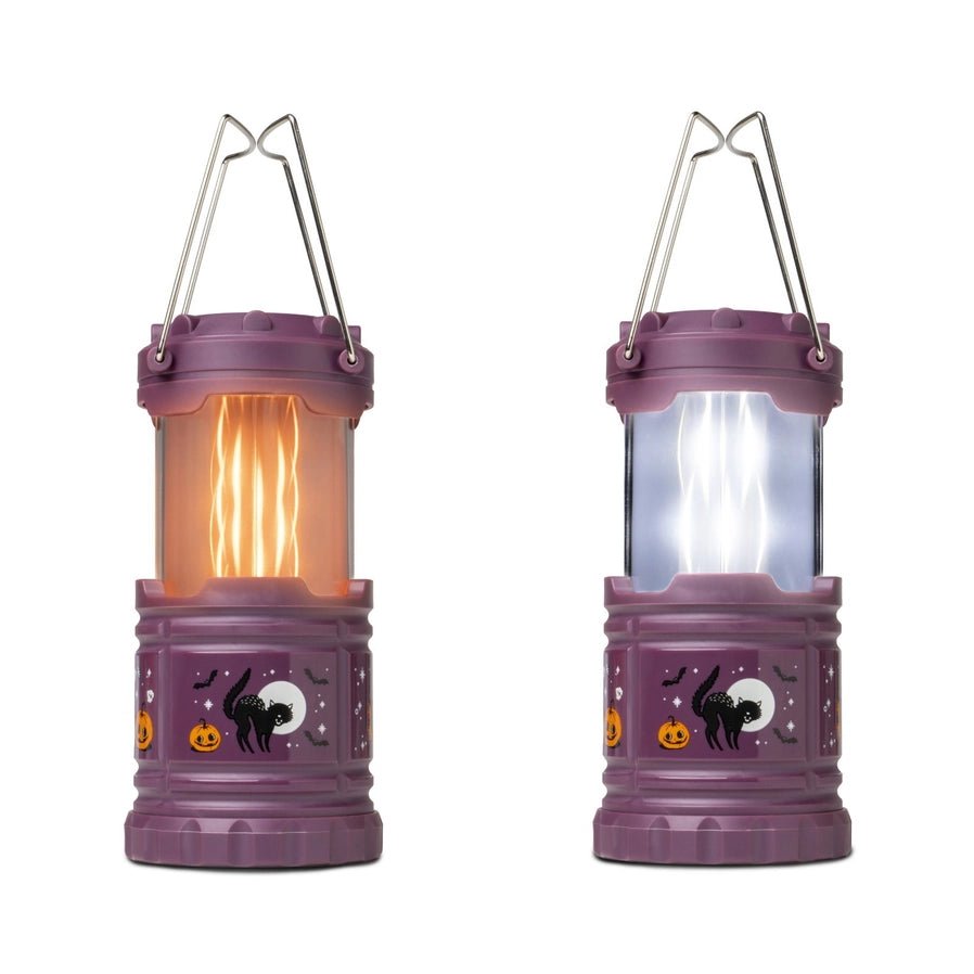 Halloween Pop-Up Lantern in purple with 2 different modes : LED white light or Flickering Flame sitting on white background. Little Gift Nook.