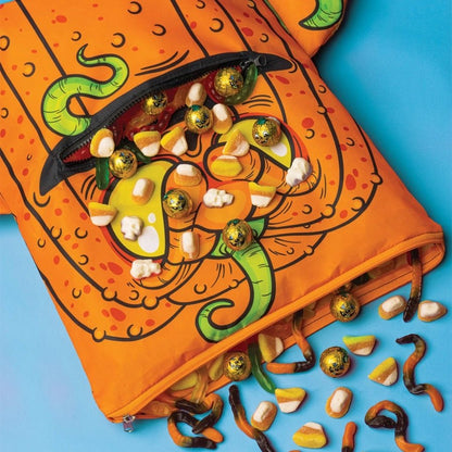 Orange Pumpkin Halloween Zipper Mouth Trick or Treat Backpack with candy pouring out on blue background.