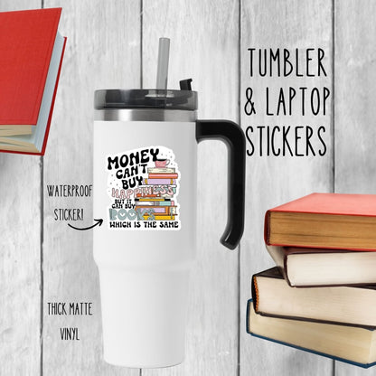white colorful sticker with books and quote "Money can't buy happiness but it can buy books which is the same" stuck on a white tumbler on a gray background.