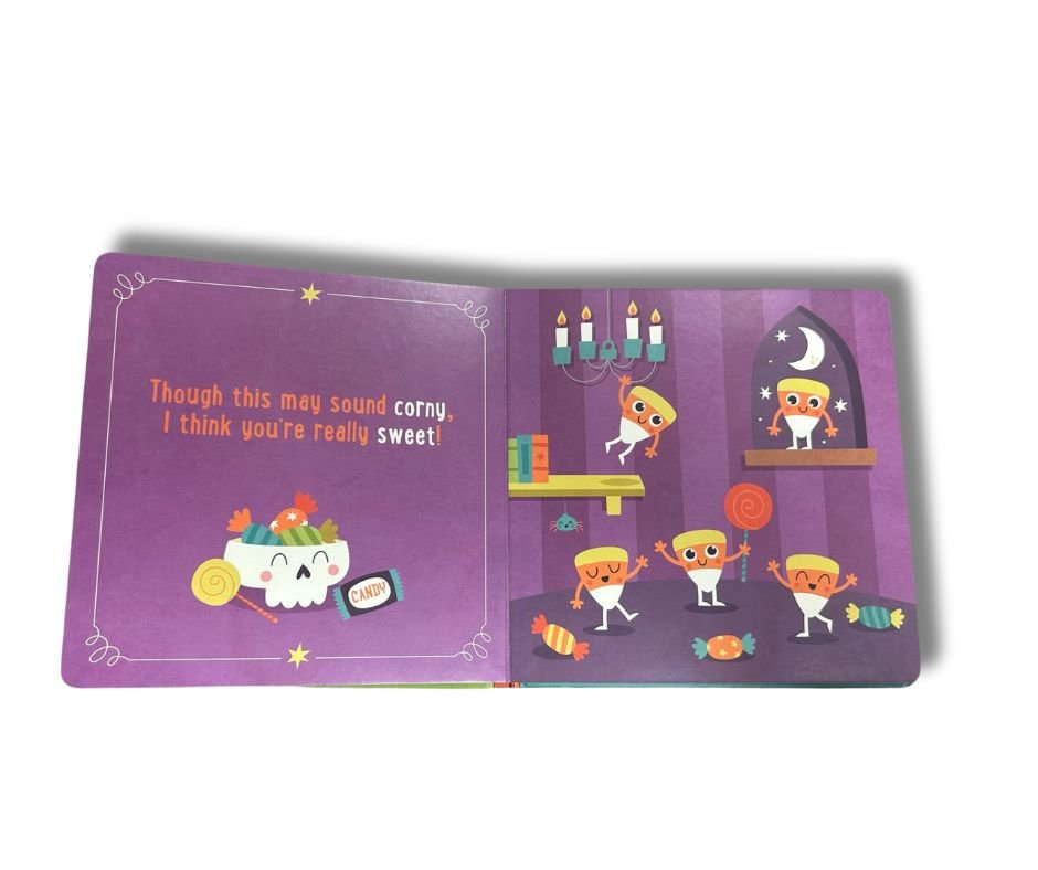 Inside little pumpkin board book with candy corn characters sitting on white background.