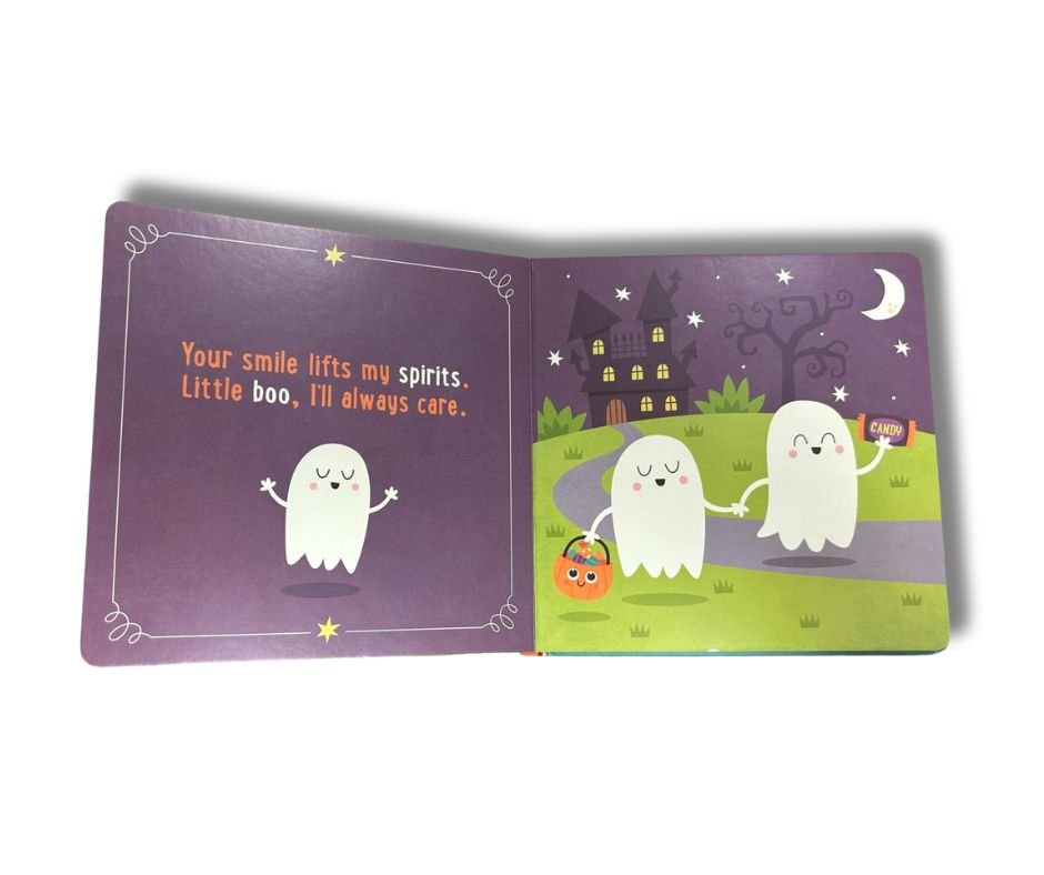 Inside little pumpkin board book with ghosts on purple pages sitting on white background. 