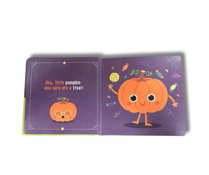 Inside the little pupmpkin board book - purple orange pages with little pumpkin sitting on white background. 
