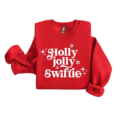 Red white Holly Jolly Swiftie sweatshirt folded on white background. 
