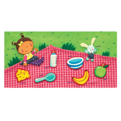Inside pages of Indestructibles "Baby Babble" book with illustrations of picnic blanket, little girl and food.