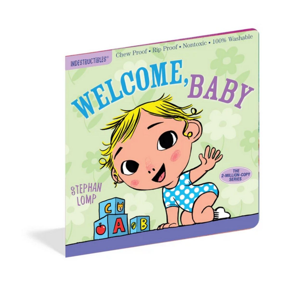 Indestructibles baby book titled Welcome, Baby tilted on angle on white background.