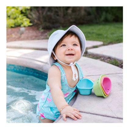 iPlay White Breathable Baby Toddler Bucket Sun Hat. UPF 50+. Hat shown on little baby in pool.  Baby through toddler sizes.- Little Gift Nook