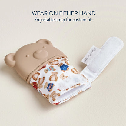 Itzy Ritzy bear teething mitt glove open with velcro closure on a tan background.