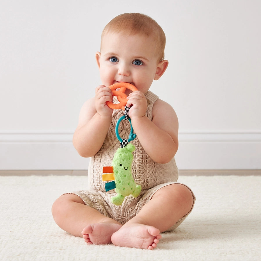 baby with tzy Pal Parker the Pickle Teether Toy - soft plush green pickle and silicone pretzel shapped teether - Little Gift Nook