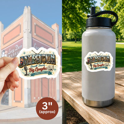 A decorative Jamestown New York sticker shown in two contexts: held by a hand against a brick building background, and stuck on a gray insulated water bottle on a wooden table outdoors. The sticker reads 'Jamestown Small Town Big Laughs' with 'Jamestown, NY' below.