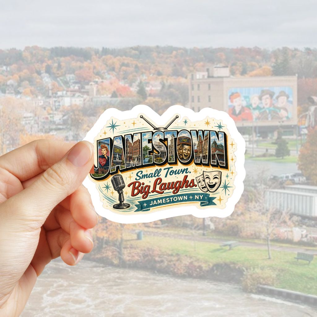 A hand holds a die-cut sticker featuring a vintage-style "Jamestown" graphic with the text 'Small Town. Big Laughs. and "Jamestown, NY" in front of faded town image.