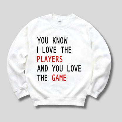 KC I Love the Players and You Love the Game Sweatshirt. White fleece lined crewneck unisex sweatshirt with black and red play on lyrics sweatshirt. Little Gift Nook.