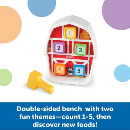 Learning Resources Barnyard Pounding Bench Toy with barn shaped toy and giant square numbered pegs with yellow toy hammer. 