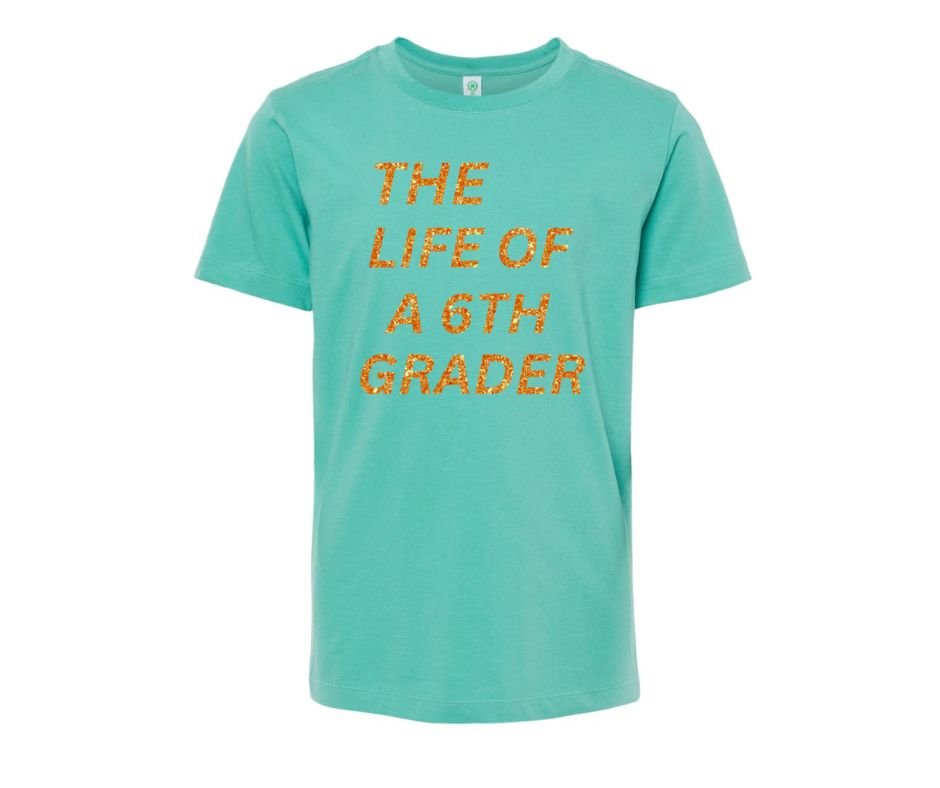 Seafoam Teal Green youth tshirt with orange glitter "Life of a 6th Grader" Tshirt on white background.