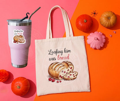 pink tumbler and creme tote bag with sourdough loaf shaped like heart with red berries in it and beside it text "loafing him was bread" image on fronts.