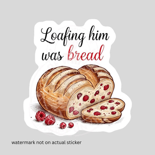 sticker with "loafing him was bread" with heart shaped loaf with red berries in it and beside on white background. Watermark on image on gray background. Little Gift Nook