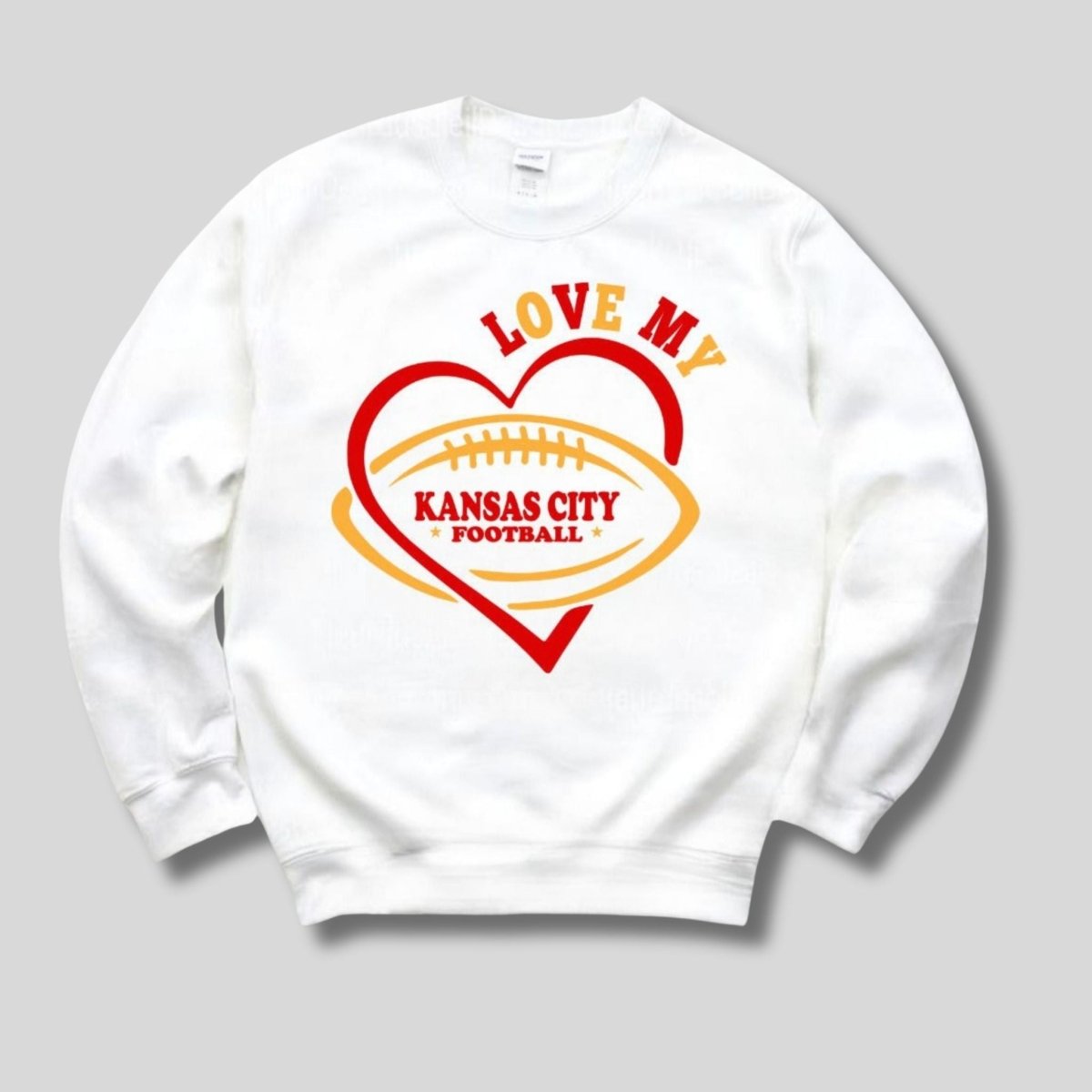 Love My Kansas City Football Sweatshirt. White fleece lined crewneck sweatshirt with red & yellow heart and LOVE MY KANSAS CITY FOOTBALL on front.  Little Gift Nook.