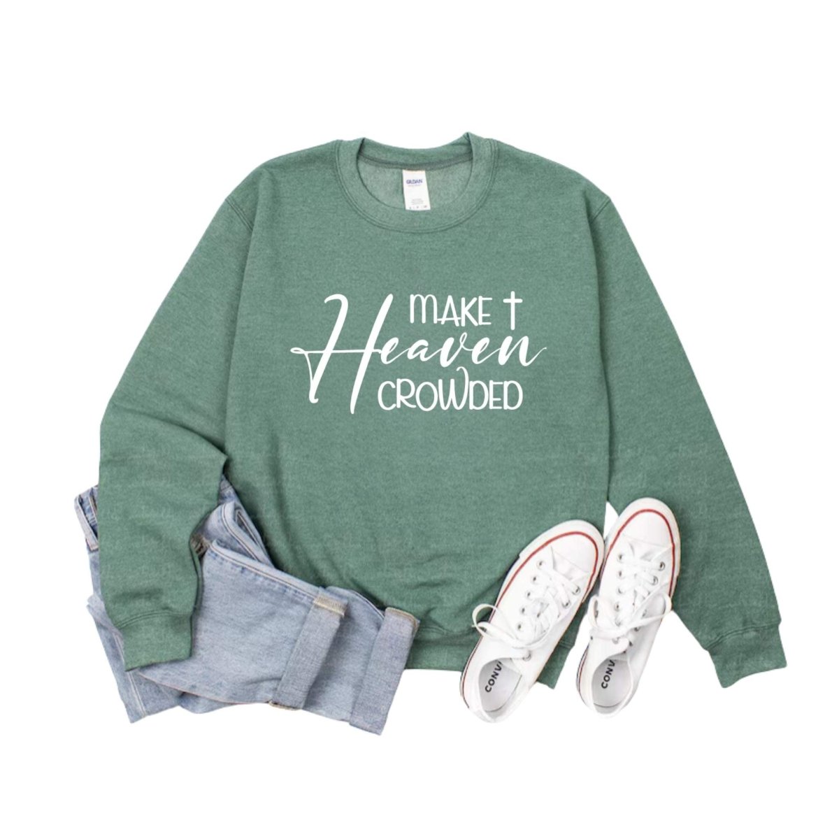 heather green crewneck sweatshirt with "Make Heaven Crowded" on front sitting with jeans and sneakers on a white background. Little Gift Nook
