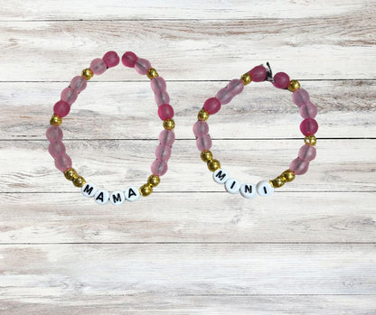 Mama and Mini Matching Beaded Bracelets - pink and gold beads with white round letter beads. One bracelet spells out MAMA other MINI - Little Gift Nook