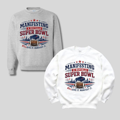 Gray and white sweatshirts with red and blue "Manifesting a Buffalo Super Bowl Billieve it manifest it" design on fronts on a light gray background.