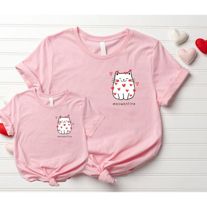 Two pink matching cat with red hearts meowentine tshirts on a white bead board background. Little Gift Nook