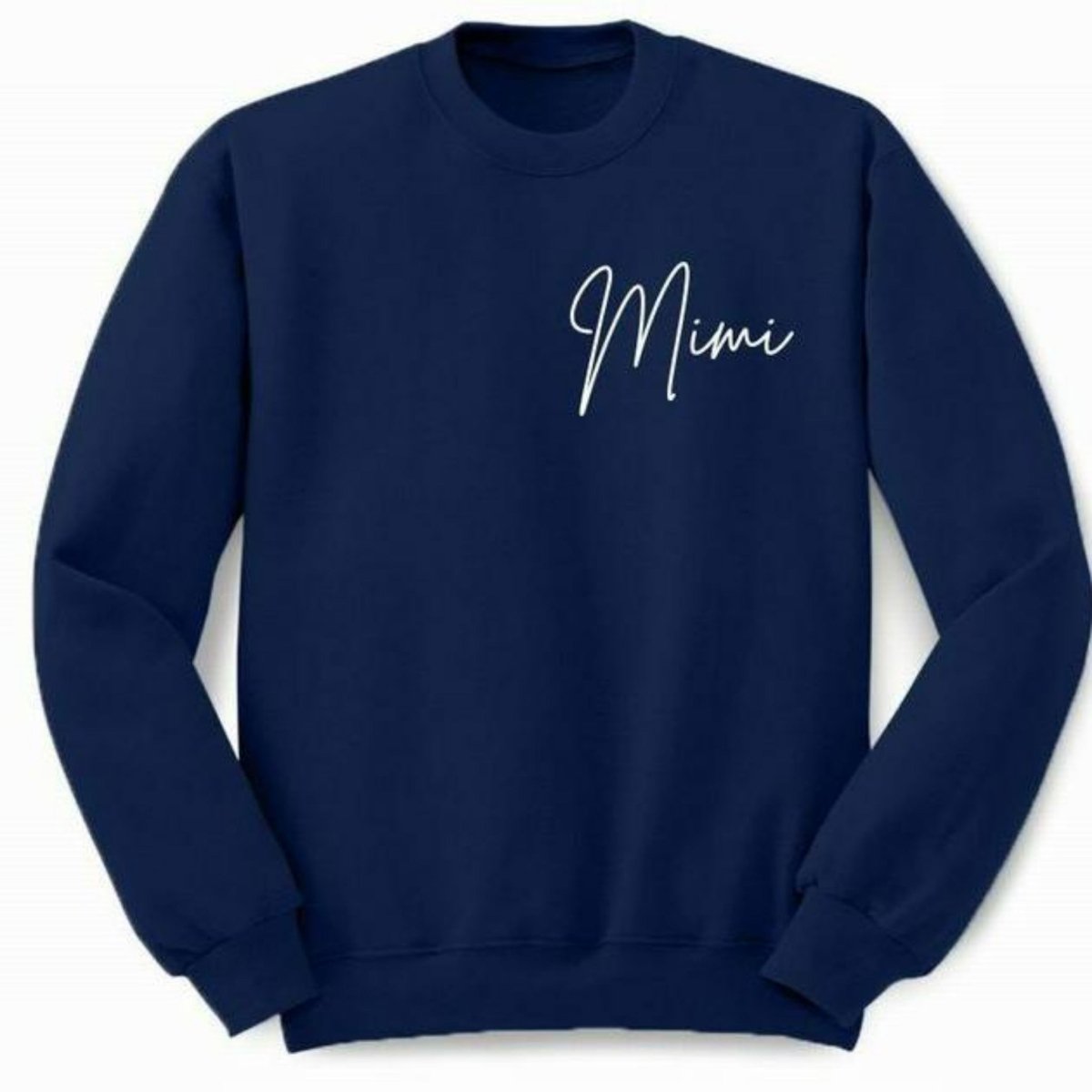 Navy crewneck sweatshirt with "Mimi" in white lettering on left chest sitting on white background. Little Gift Nook
