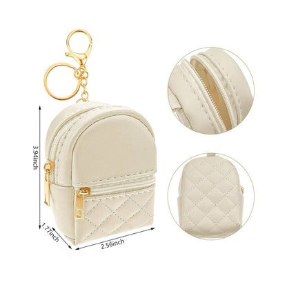 Cream quilted Mini Backpack Coin Purse Keychain with 2 pockets that open with gold zippers and gold ring, chain, and lobster clip. Measures 3.94 inches tall.  Little Gift Nook.